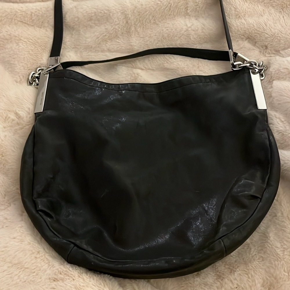 Micheal Kors black soft leather boho purse in really good condition.